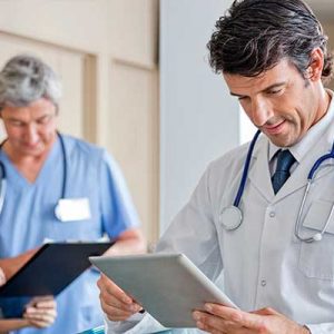 physician reviewing charts in office location